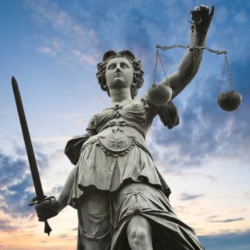 Statue holding scales of justice; Law