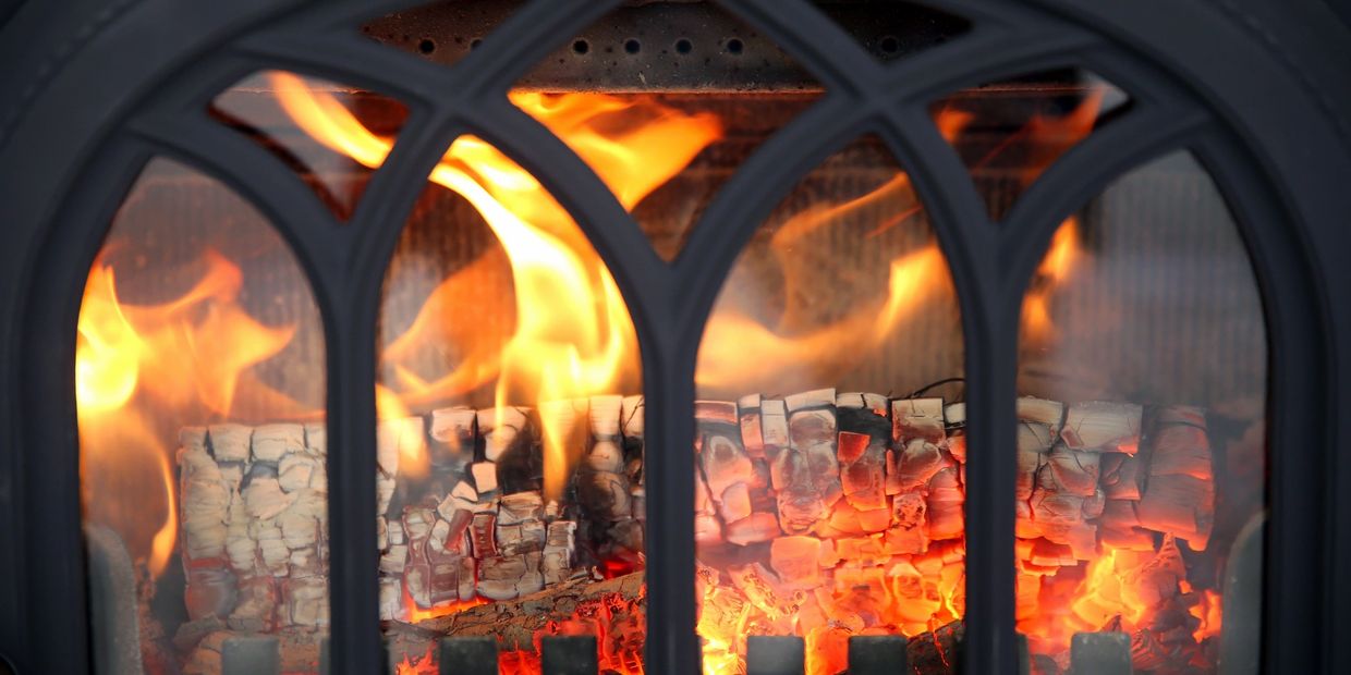roaring fire in a clean wood heated fireplace