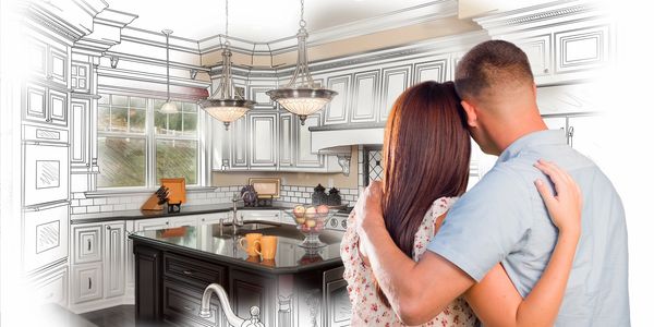 couple looking at their new kitchen in their new home