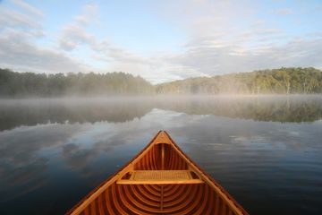 Red Oar Writing canoe on a lake 