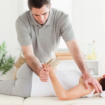 a chiropractor performing a chiropractic treatment on a patient