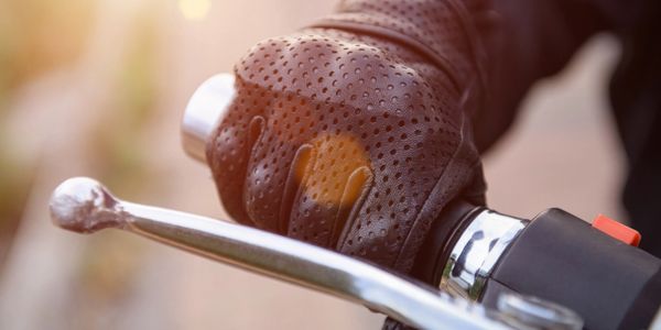 Close up of motorcycle rider wearing a motorcycle glove