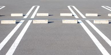 Parking Lot striping and Concrete Wheel stops bumper blocks wheel stops installation repair asphalt