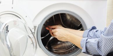 Clean your washing machine gasket to avoid leaks from the door. Also don't overload washers.