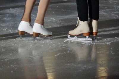 figure skaters on the ice at ice arena