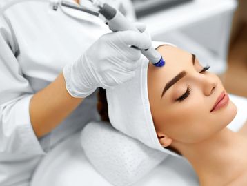 Image of woman receiving micro needling session