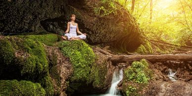 Person finding peace through meditation in nature