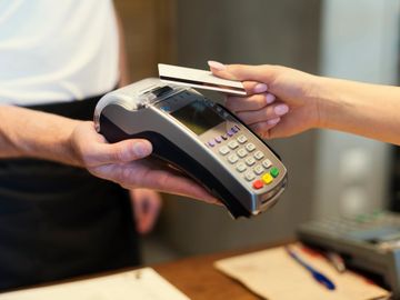 credit card machine being used with a customer