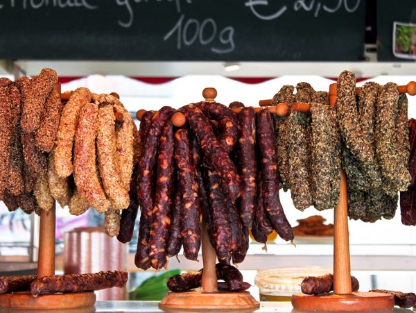 Different types of delicious sausages on display.