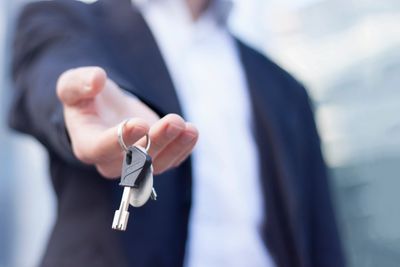 Man holding keys- investment