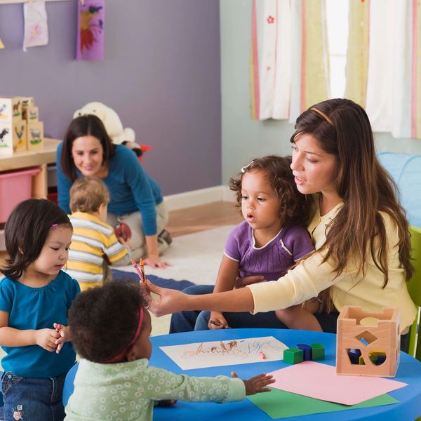 Toddlers learning with teacher
