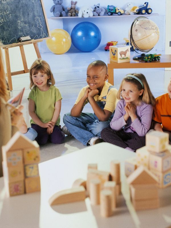children learning with their teacher at daycare