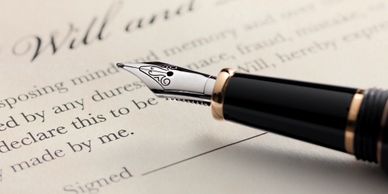 picture of a fountain pen on a legal document. 