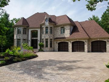 One multi-story home with a three-car garage. 