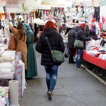 leather goods and handbags for sale at a flea market stall Stock