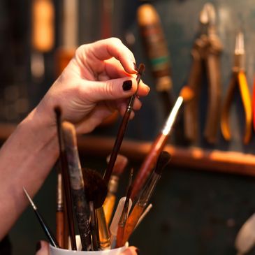artist choosing paintbrush