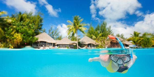 Woman snorkeling at Resort in the Caribbean 