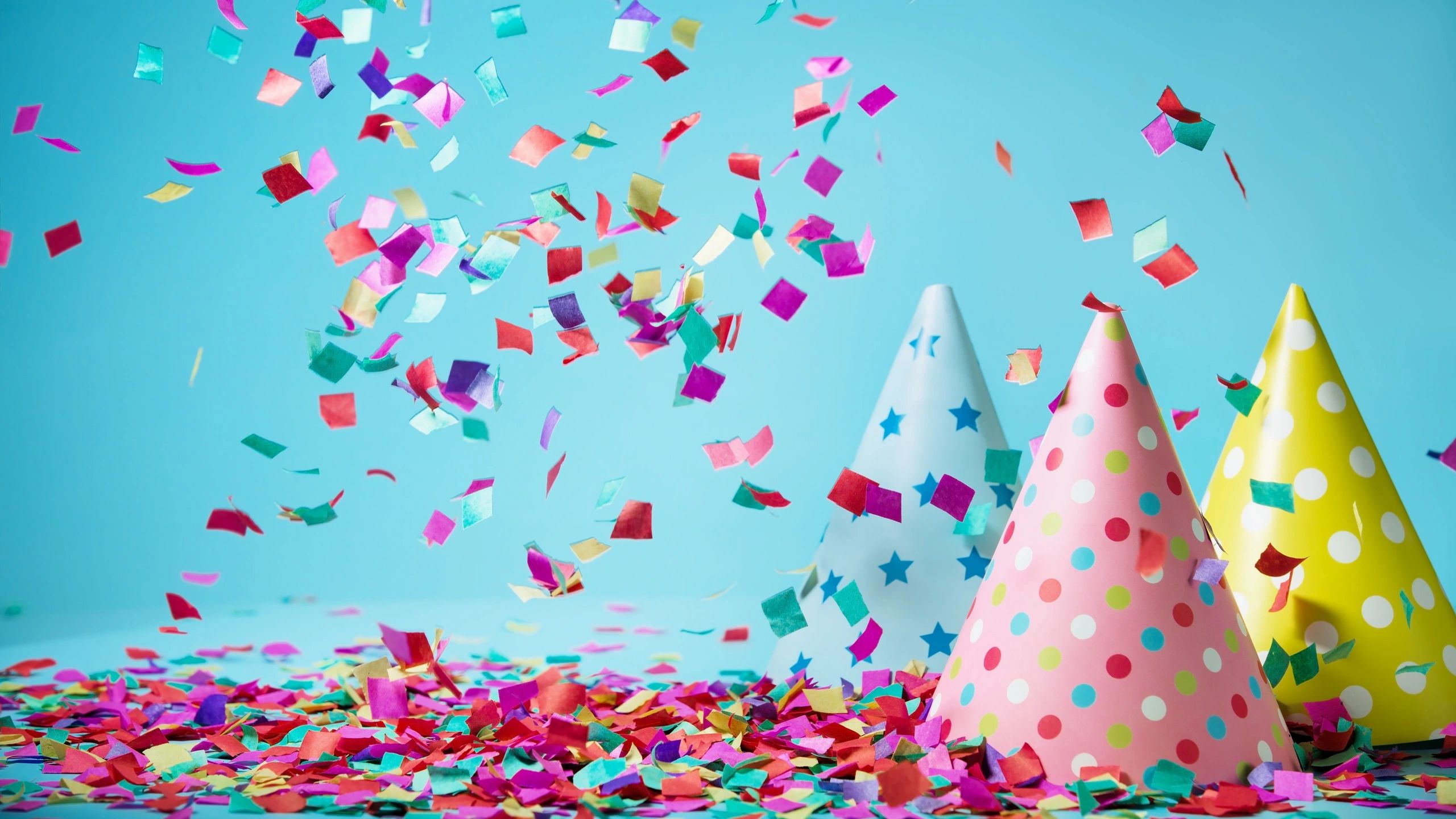 Party hats and confetti celebrating birthdays