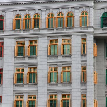 Hotel exterior windows with colored grates.