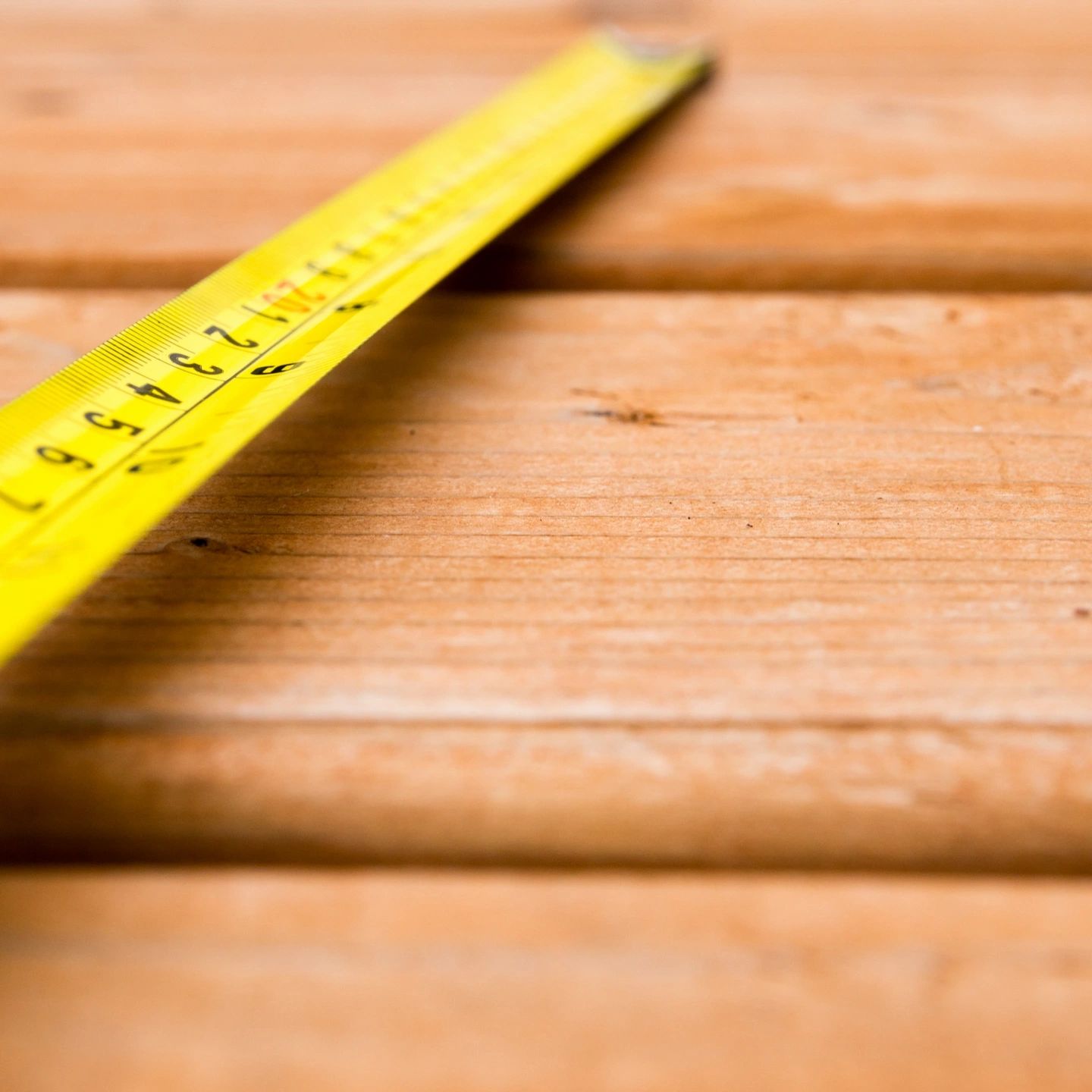 a Tape measure on a wooden table