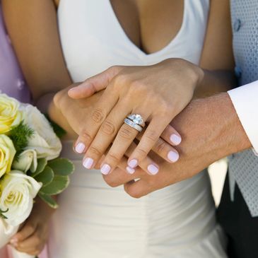 Couple holding hands in marriage ceremony 