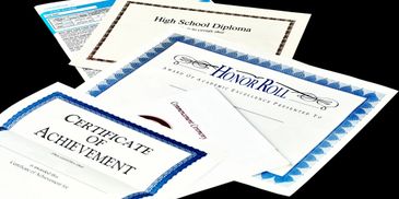 Diplomas and certificates of achievement representing professional licenses and memberships.