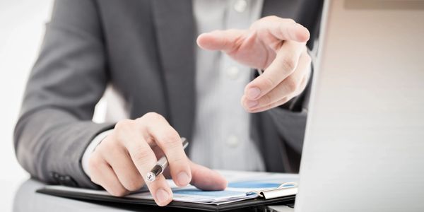 Image of person working on laptop computer.