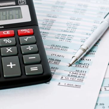 Calculator, bills, tax return, pen and results.