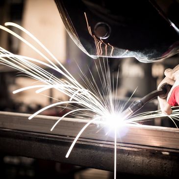 Welder manufacturing a batch of products. 