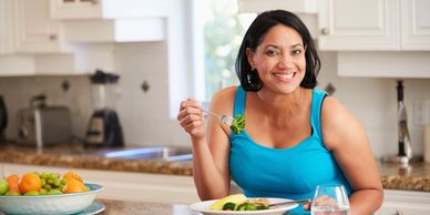 A woman enjoys a healthy, satisfying meal