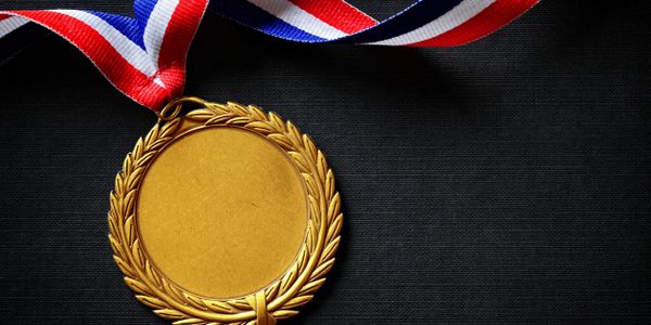 A medal that has no text engraved, but is awaiting engraving.