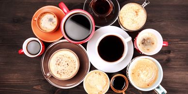 multiple different cups of coffee and coffee drinks
