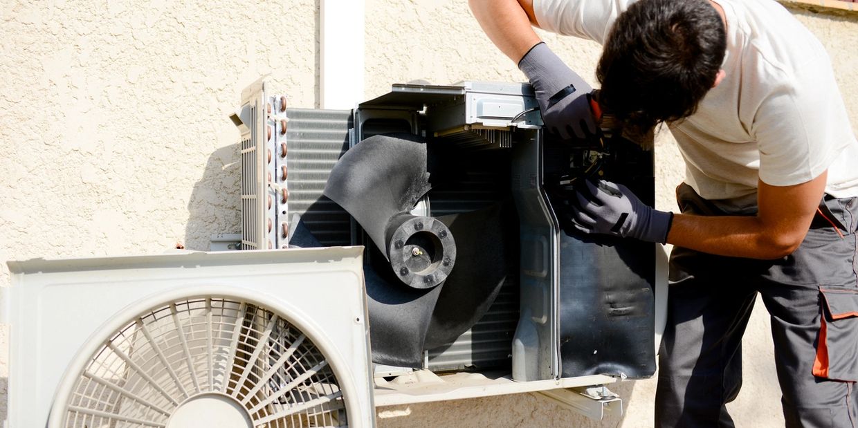 Bonded Mechanical technician installing Air Conditioning 