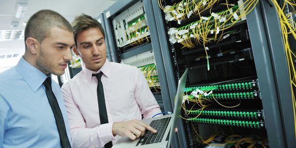 Technicians setting up a network.