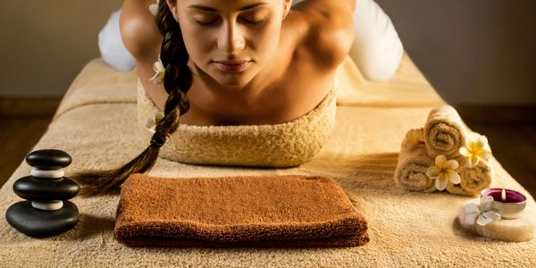 a woman getting Vedic Thai Yoga Massage

