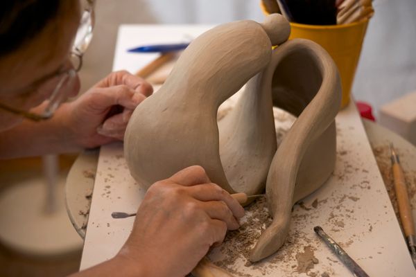 hand-building clay, carving