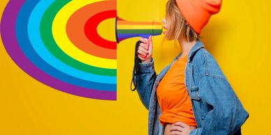 A woman shouting into a megaphone with a rainbow coming out the other side.