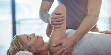 Patient receiving shoulder mobility work, 
