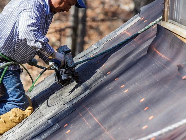 Sioux Falls Roofing Company Installing Shingles