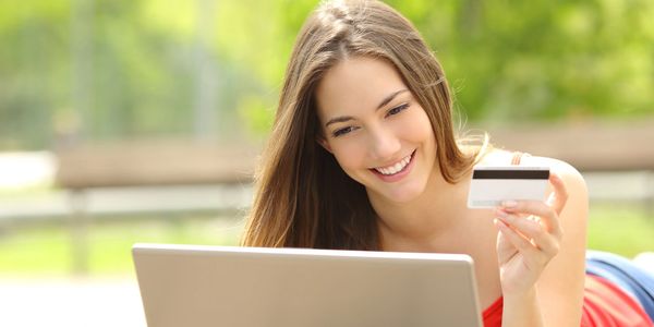 Pay Your Rent Online - Girl using laptop and paying online