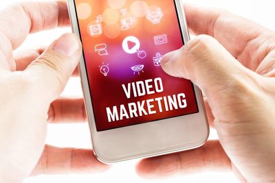 tapping on the mobile phone about video marketing