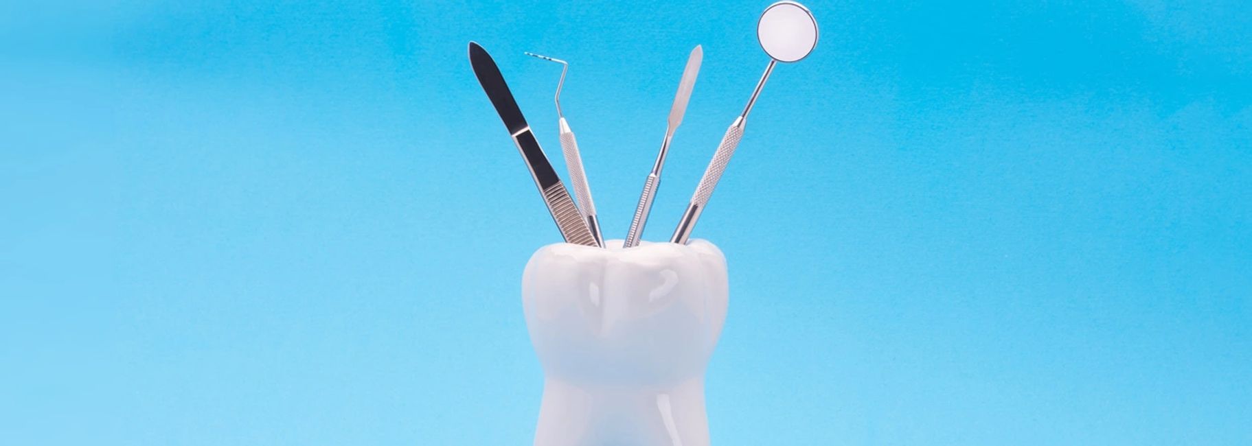 Orthodontic tools in a tooth holder.