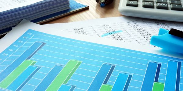 Excel worksheet and chart lying on desk