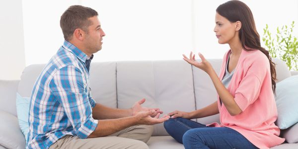 Couple communication on a couch. Developing a healthy relationship through couples counseling.