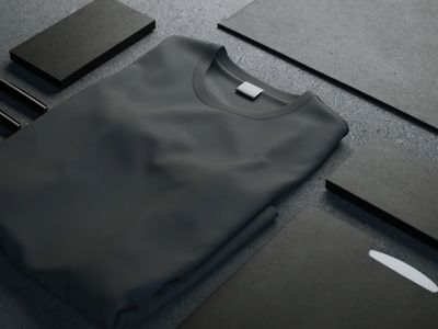 Black t-shirt laying on a dark surface