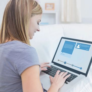 young adult female on laptop