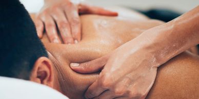 Stock photo of male client receiving massage therapy at Russellville Massage Clinic