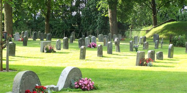 cemetery headstones string trimmed