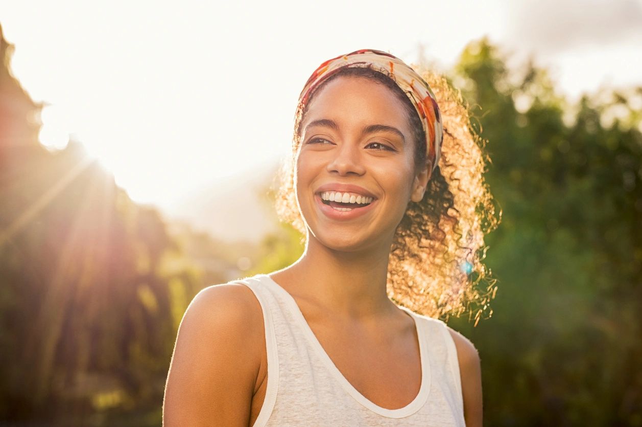 Woman smiling in the sunshine