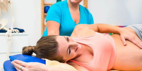 Chiropractor adjusting a pregnant woman